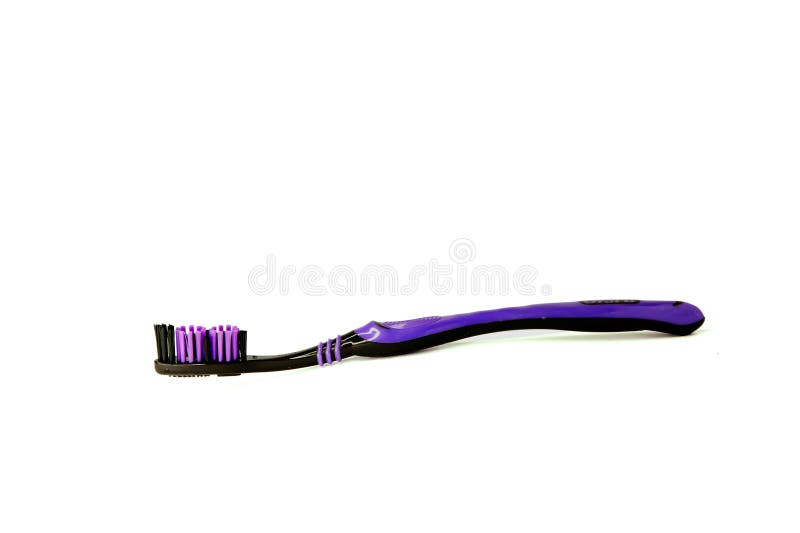 Purple toothbrush on a white isoleted background stock photography