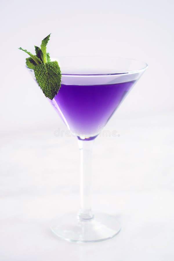 Purple Martini Cocktail with Mint Garnish