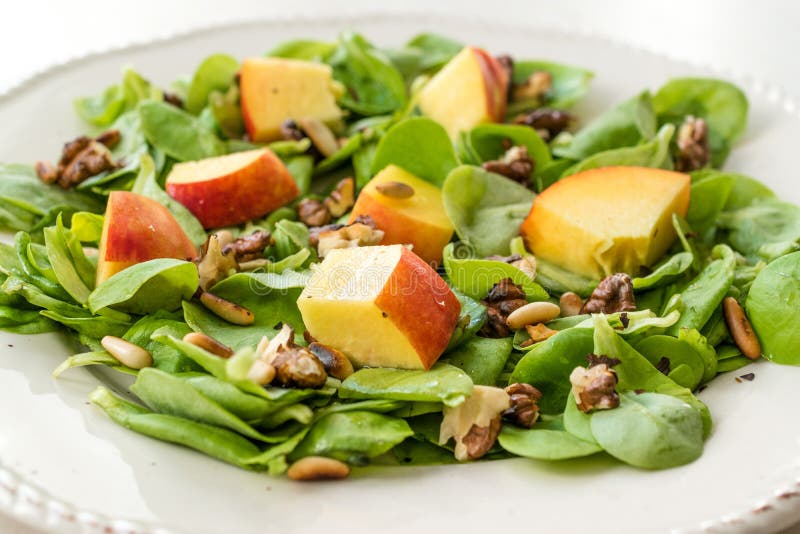 Purslane Salad with Peach Fruit, Roasted Walnuts and Pine Nuts