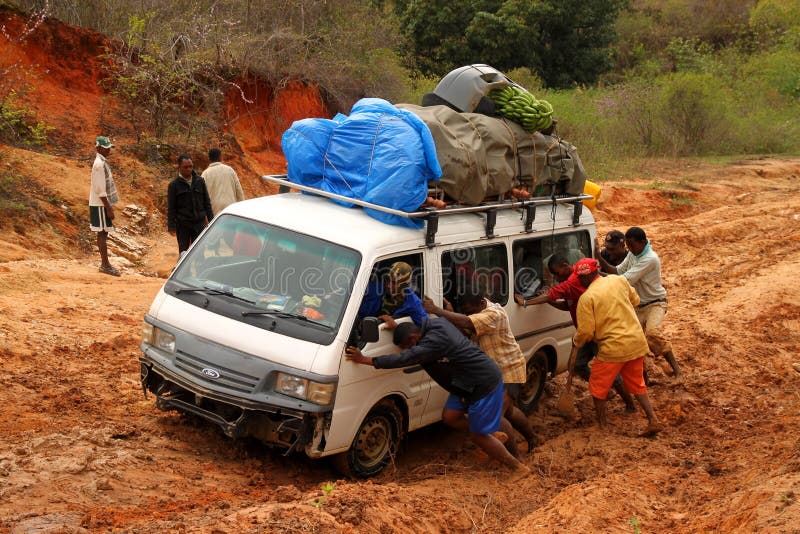 Pushing The Car Out Of Mud Editorial Image Image 25980795