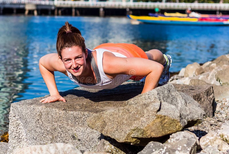 Pushup on seaside rock stock photography Pushup on seaside rock stock photography
