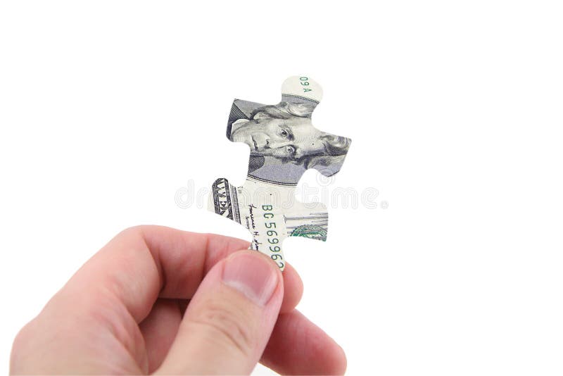 Pussel för dollarhandhåll arkivbilder