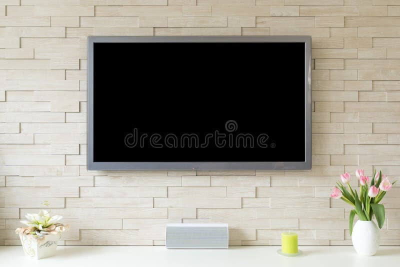Pusty nowożytny płaski ekran TV przy białym ściana z cegieł z kopii przestrzenią