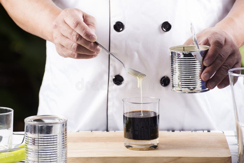 Putting Condensed Milk in To Hot Coffee Stock Image Image of espresso