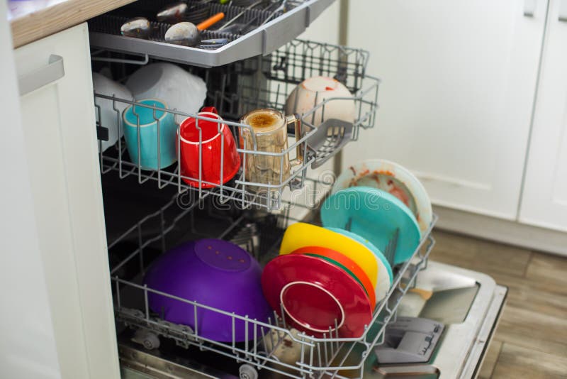 Putting Dirty Plates in the Dishwasher after Dinner Stock Image Image of fork, dishware 210772421