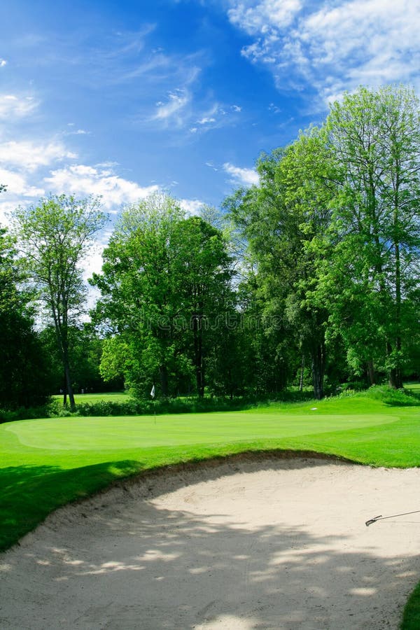 Putting green and sand trap stock photos