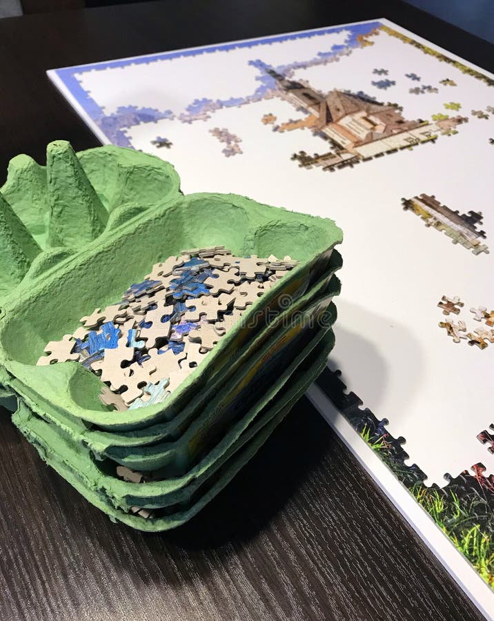 Puzzle assembling workspace with unique sorters stock photography Puzzle assembling workspace with unique sorters stock photography