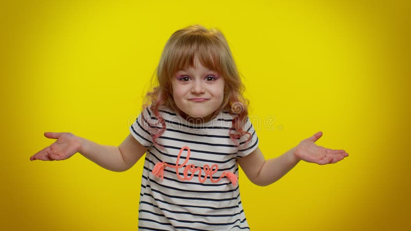 Puzzled clueless uncertain blonde kid child raising hands in helpless gesture, difficult question