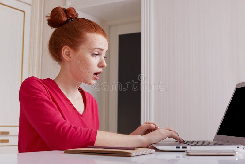 Puzzled Female Talented Editor of Online Issue Works Remotely at Home,  Dressed Casually, Has Red Hair Tied in Hair Bun, Creats Art Stock Image -  Image of hands, concentrated: 106147083