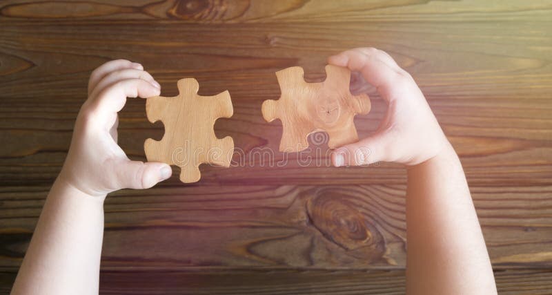 Puzzles in hands. logics. stock photography Puzzles in hands. logics. stock photography
