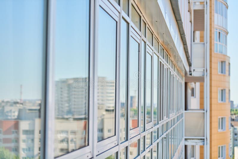 PVC windows on facade of skyscraper stock images