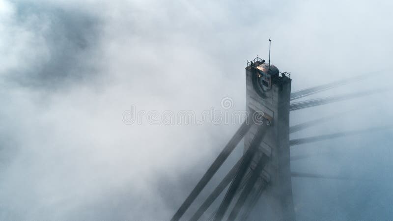 Pylon of the North Bridge or Moscow Bridge in dense dense fog in Kiev, Ukraine royalty free stock image Pylon of the North Bridge or Moscow Bridge in dense dense fog in Kiev, Ukraine royalty free stock image