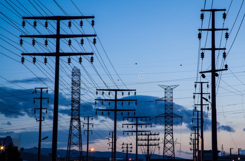 Pylons at twilight. High-voltage power lines. Electricity distribution station. High voltage electric transmission tower. royalty free stock images Pylons at twilight. High-voltage power lines. Electricity distribution station. High voltage electric transmission tower. royalty free stock images