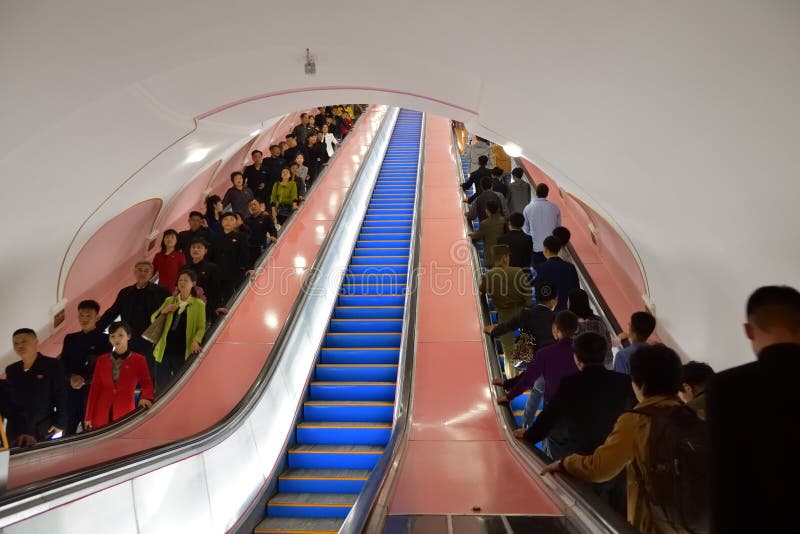 Pyongyang, North Korea. People at Metro station. Pyongyang, North Korea - May 1, 2019: People on the escalator of the Kaeson subway station in Pyongyang Metro royalty free stock photo Pyongyang, North Korea. People at Metro station. Pyongyang, North Korea - May 1, 2019: People on the escalator of the Kaeson subway station in Pyongyang Metro royalty free stock photo