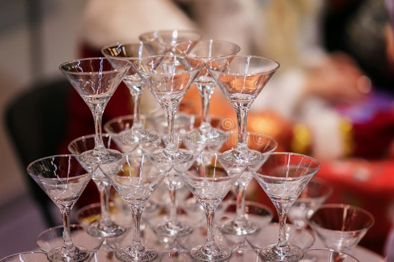 Pyramid of glasses, still empty, for beverages, wine, champagne, festive mood, celebration