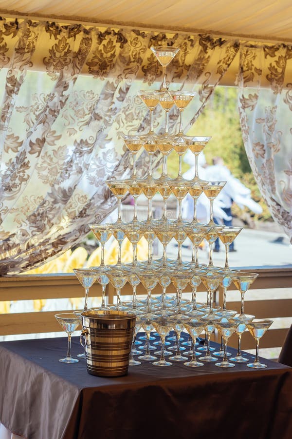 Pyramid of Glasses Champagne on Wedding Party. Champagne Glass Pyramid