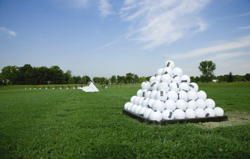 Pyramid of Golf Balls on the Practice Tee stock photos Pyramid of Golf Balls on the Practice Tee stock photos