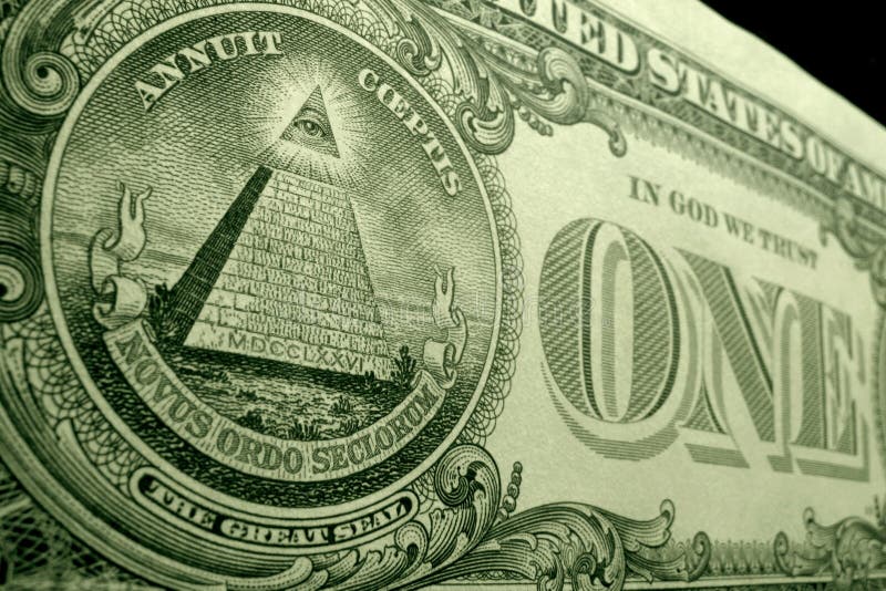 Low angle, shallow depth of field shot of pyramid, from the great seal, on the back of the US dollar bill.