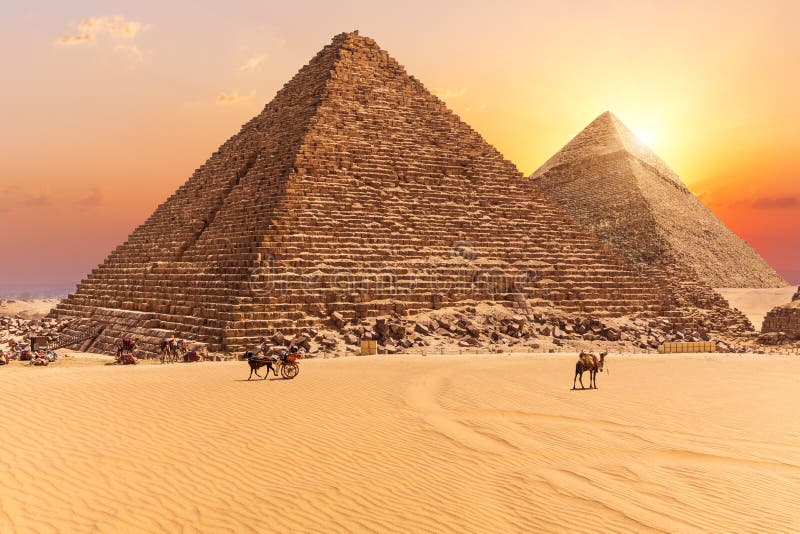 The Pyramid of Menkaure and the Pyramid of Khafre in the sunset rays, Giza desert royalty free stock photos The Pyramid of Menkaure and the Pyramid of Khafre in the sunset rays, Giza desert royalty free stock photos