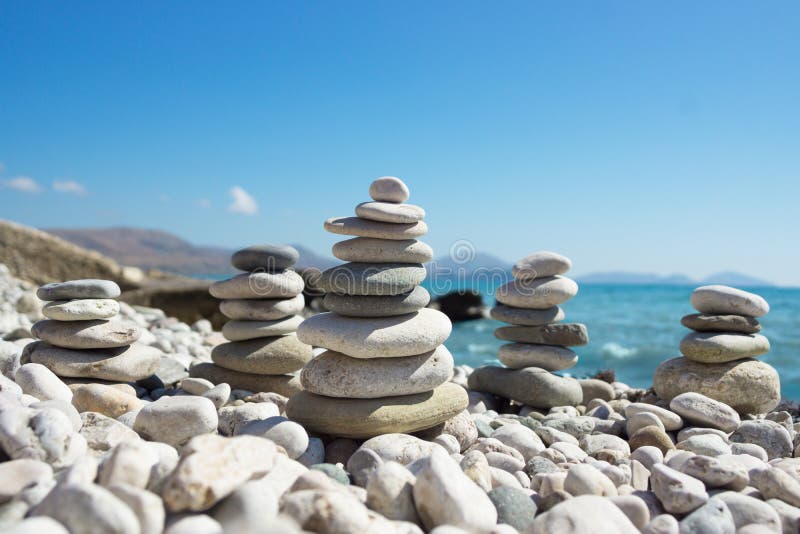 Pyramid of pebbles on a sea beach. royalty free stock photography