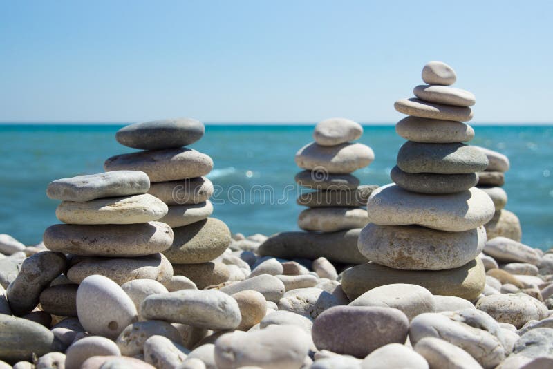 Pyramid of pebbles on a sea beach. royalty free stock image