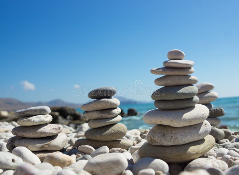 Pyramid of pebbles on a sea beach. stock photos