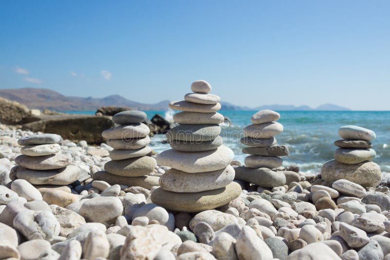 Pyramid of pebbles on a sea beach. royalty free stock photo