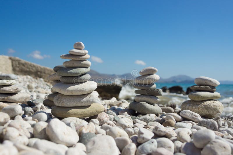 Pyramid of pebbles on a sea beach. royalty free stock photos