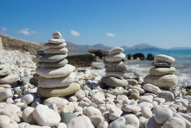 Pyramid of pebbles on a sea beach. royalty free stock images
