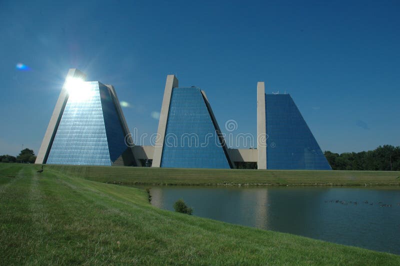 Pyramid shaped buildings stock image. Image of mirrored 194715