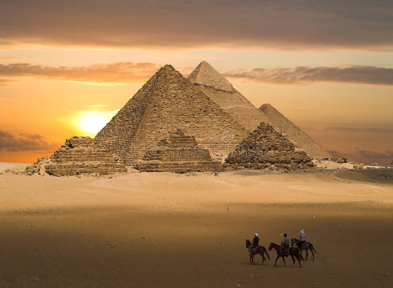 The Pyramids of Gizeh near Cairo in Egypt during a golden sunset. The Pyramids of Gizeh near Cairo in Egypt during a golden sunset.