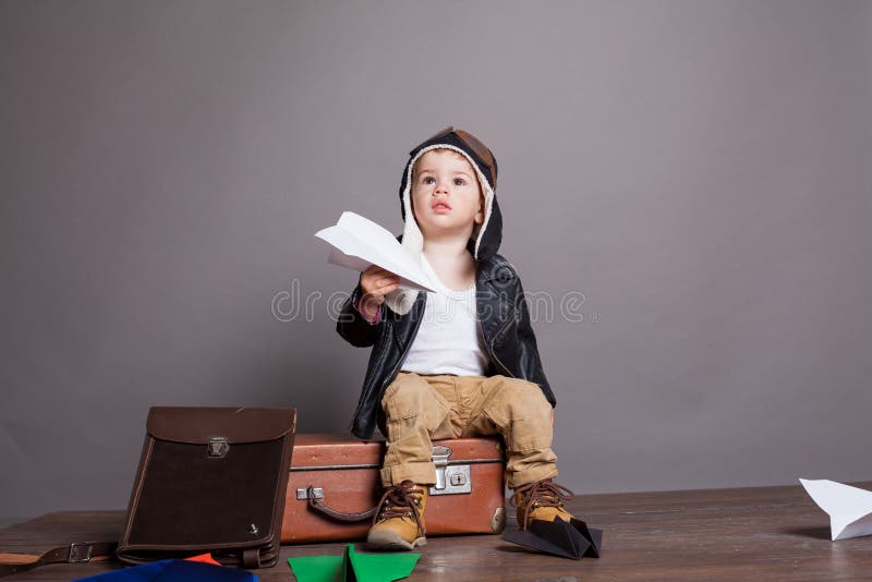 Little boy pilot plays in the paper plane 1. Little boy pilot plays in the paper plane 1