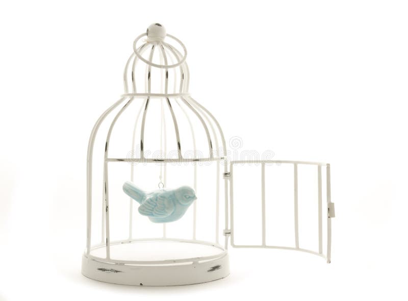 Blue ceramic bird hanging in vintage wire painted cage. Blue ceramic bird hanging in vintage wire painted cage