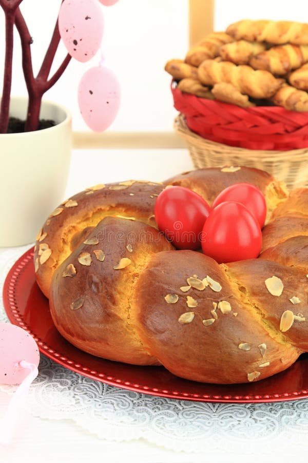 Easter sweet bread with red eggs and shortbread cookies. Easter sweet bread with red eggs and shortbread cookies