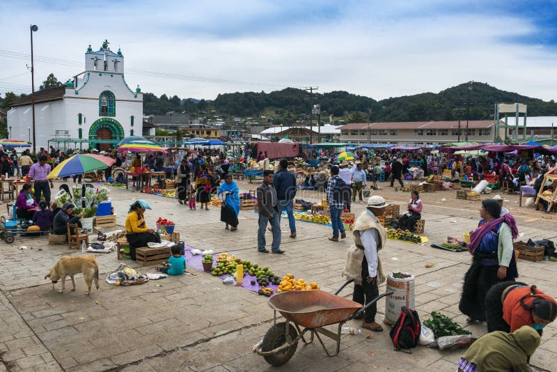 San Juan Chamula, Mexico - May 11, 2014: People at a street market in the town of San Juan Chamula, in Chiapas, Mexico. San Juan Chamula, Mexico - May 11, 2014: People at a street market in the town of San Juan Chamula, in Chiapas, Mexico