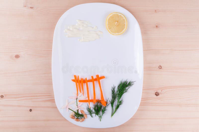 På en vit platta som beautifully ut läggas en morot, en citron och en dill arkivbilder På en vit platta som beautifully ut läggas en morot, en citron och en dill arkivbilder