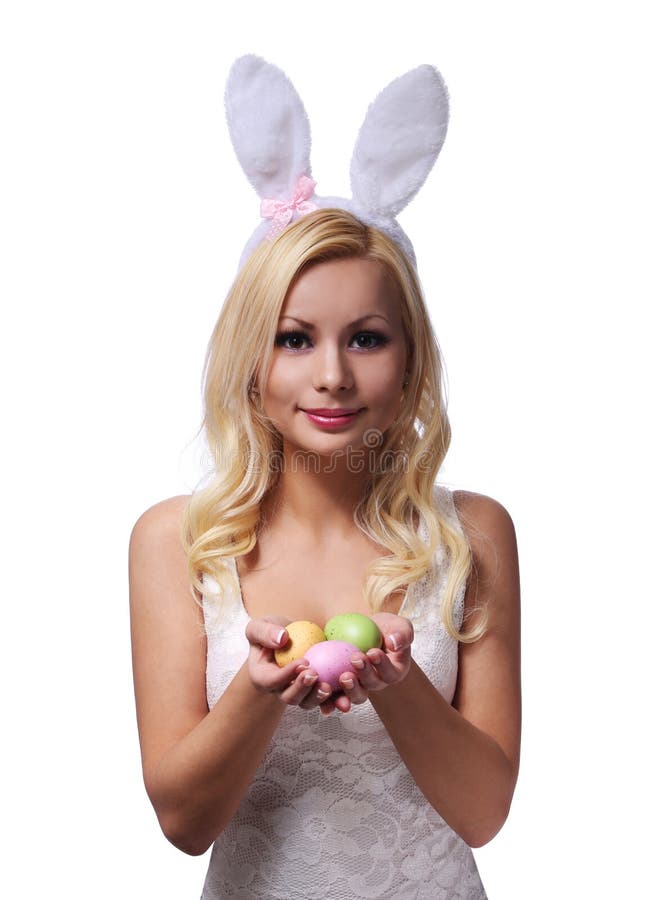 Påskkvinna med Bunny Ears som rymmer färgrika ägg arkivbild Påskkvinna med Bunny Ears som rymmer färgrika ägg arkivbild