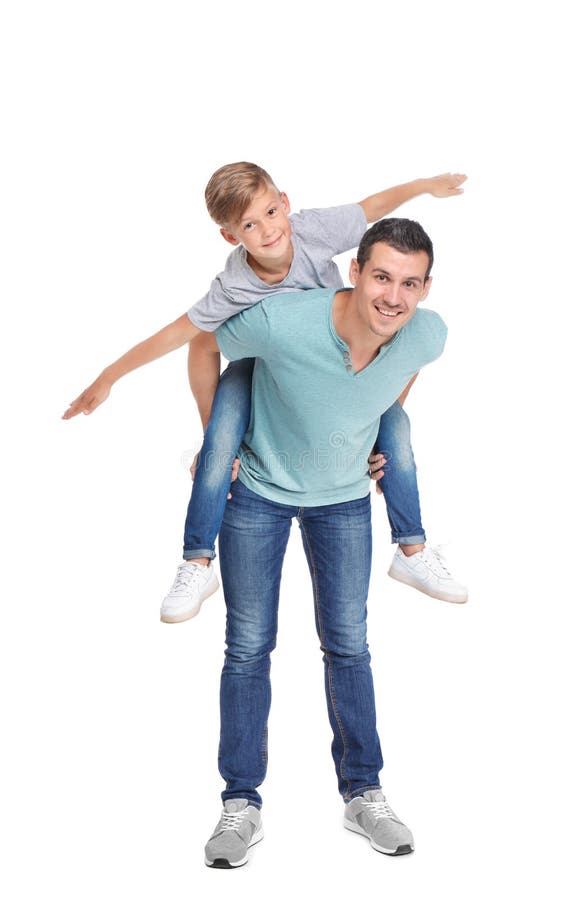 Père avec l'enfant sur le fond blanc photo libre de droits Père avec l'enfant sur le fond blanc photo libre de droits