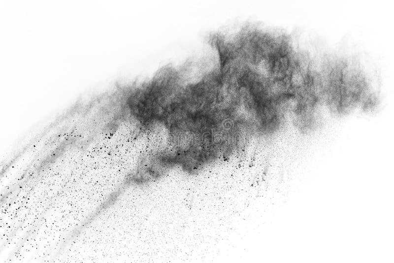 Particles of charcoal on white background,abstract powder splatted on white background,Freeze motion of black powder exploding or throwing black powder. Particles of charcoal on white background,abstract powder splatted on white background,Freeze motion of black powder exploding or throwing black powder.