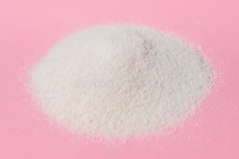 Natural collagen powder over pink background, concept of healthy skin. Natural collagen powder over pink background, concept of healthy skin