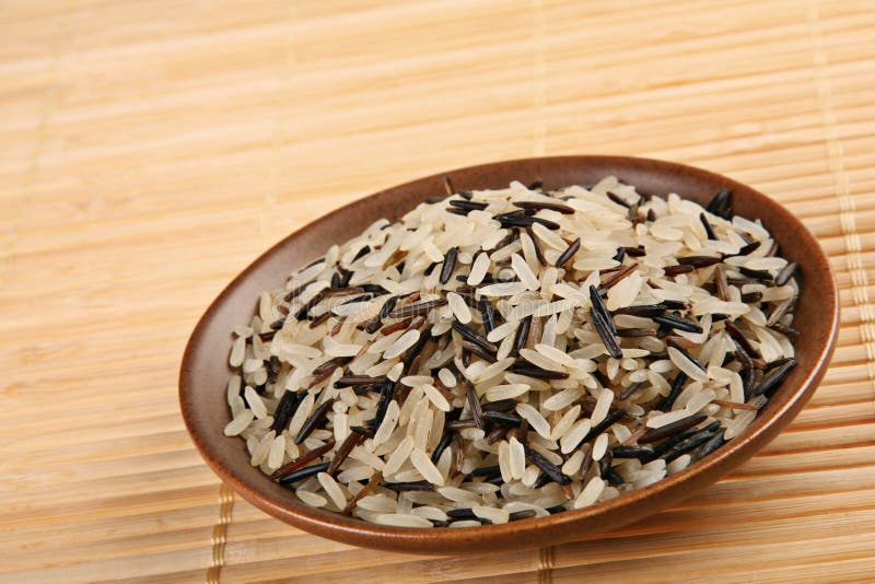 Wild rice detail view in brown plate. Wild rice detail view in brown plate