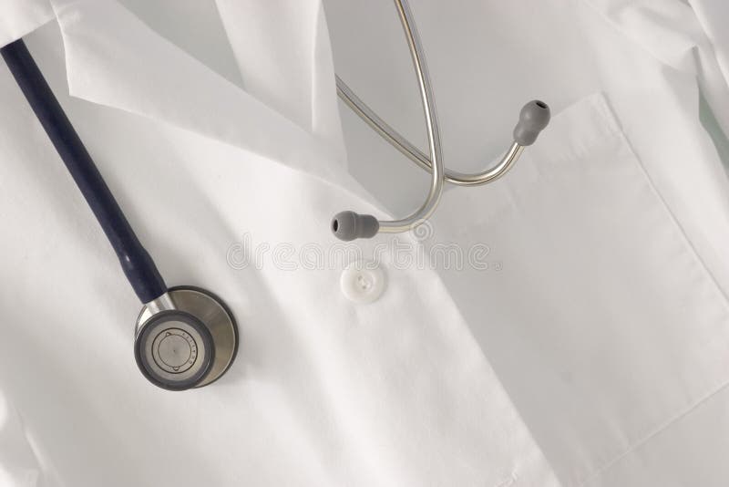 A stethoscope draped over a doctor's lab coat. A stethoscope draped over a doctor's lab coat