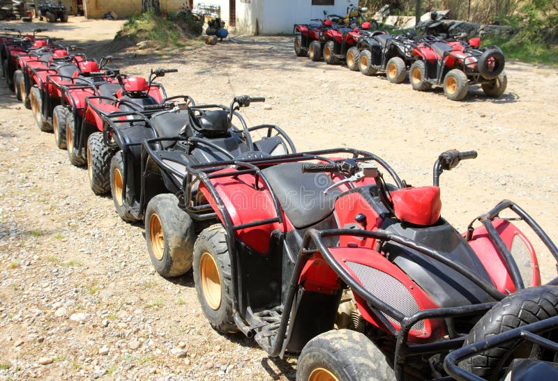 Quad bikes atv in row