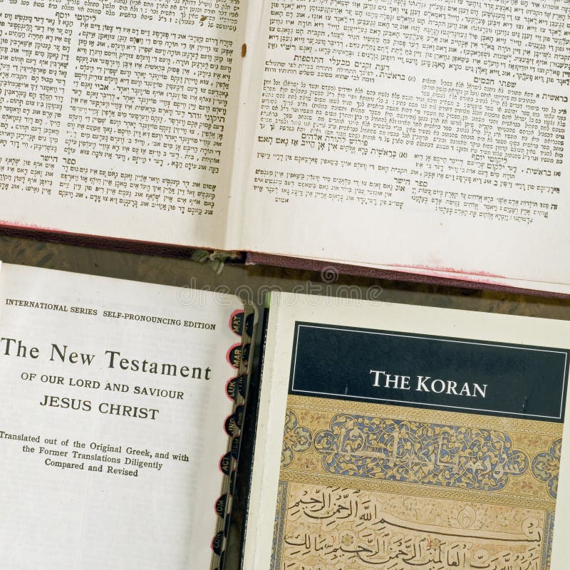 showing Three faiths holy books the Christian bible and Koran and Hebrew jewish bibles on a table showing three of the many religions in the world and showing that the three religions shown here are to represent all of them in the world and to show these religions as examples and all are equal hebrew and arabic are both semitic languages and are written right to left while english is written left to right. showing Three faiths holy books the Christian bible and Koran and Hebrew jewish bibles on a table showing three of the many religions in the world and showing that the three religions shown here are to represent all of them in the world and to show these religions as examples and all are equal hebrew and arabic are both semitic languages and are written right to left while english is written left to right