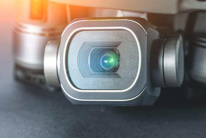 Quadrocopter with a Camera, Closeup. Large Lens Flare on the Camera