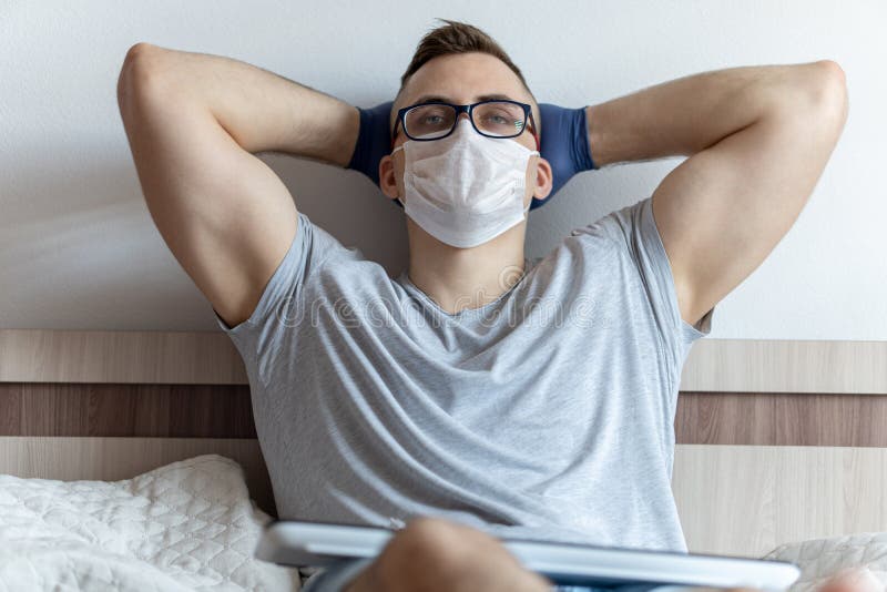 The quarantined guy works remotely from home. Communication, people and freelance work concept stock images