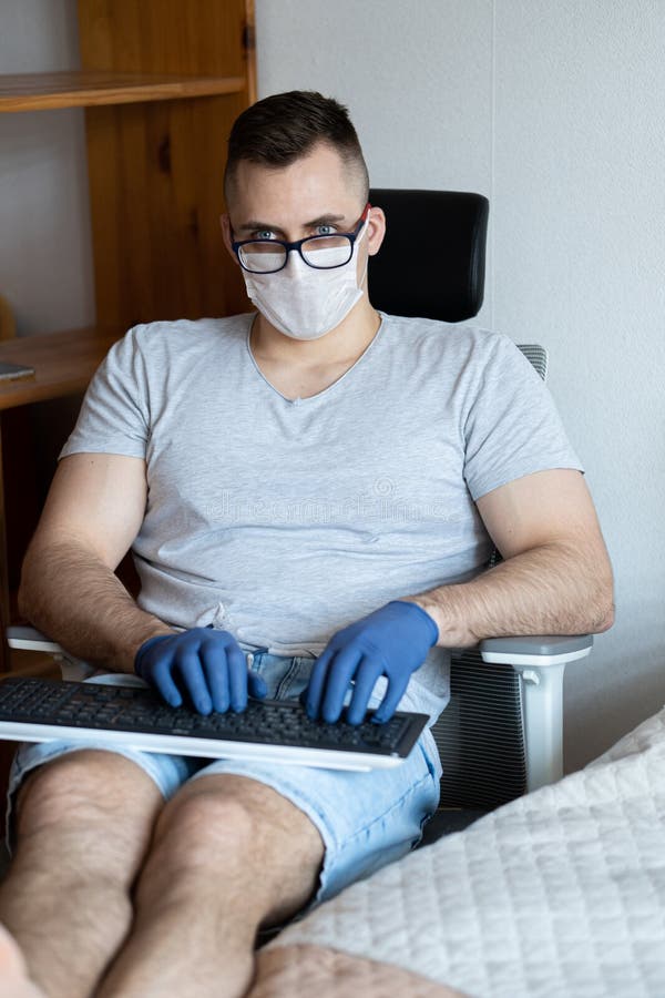 The quarantined guy works remotely from home. Communication, people and freelance work concept royalty free stock photo