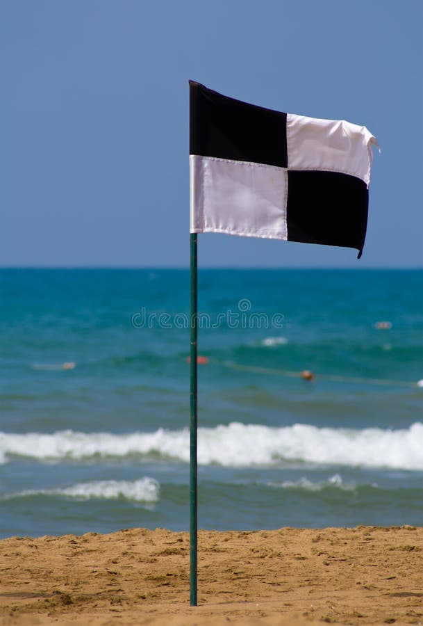 Quartered Black And White Flag On The Beach Stock Image Image of