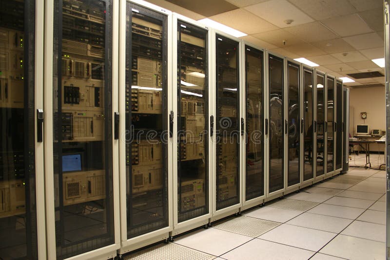 A row of cabinets in a computer server room or datacenter. A row of cabinets in a computer server room or datacenter