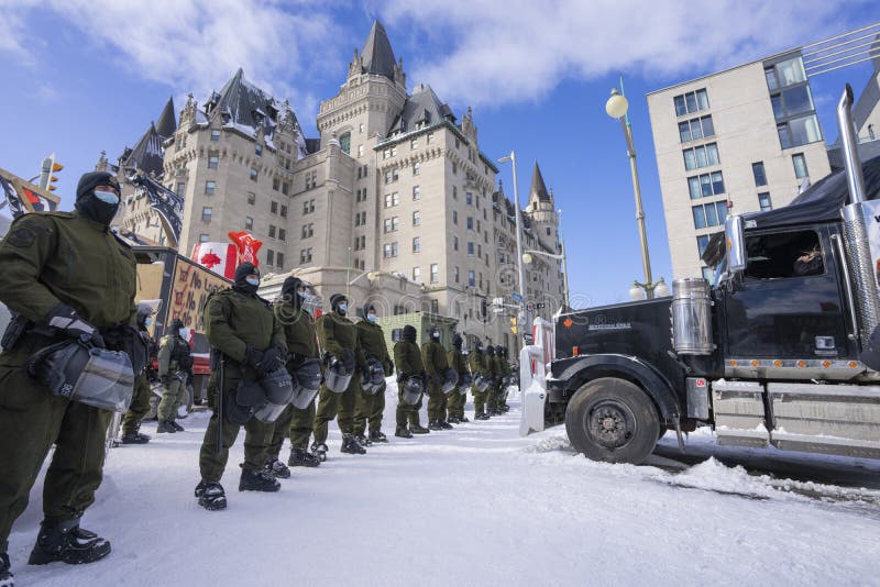 Quebec Provincial Police SÃ»retÃ© du QuÃ©bec advance on one of the trucks at the Freedom Convoy protest in Ottawa